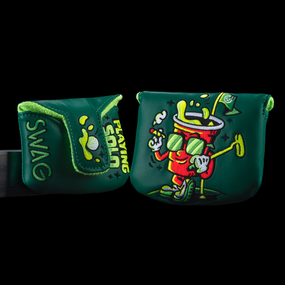SWAG Golf Playing Solo mallet putter cover with bold character artwork and dark green SWAG branding. Features "PLAYING SOLO" wording.