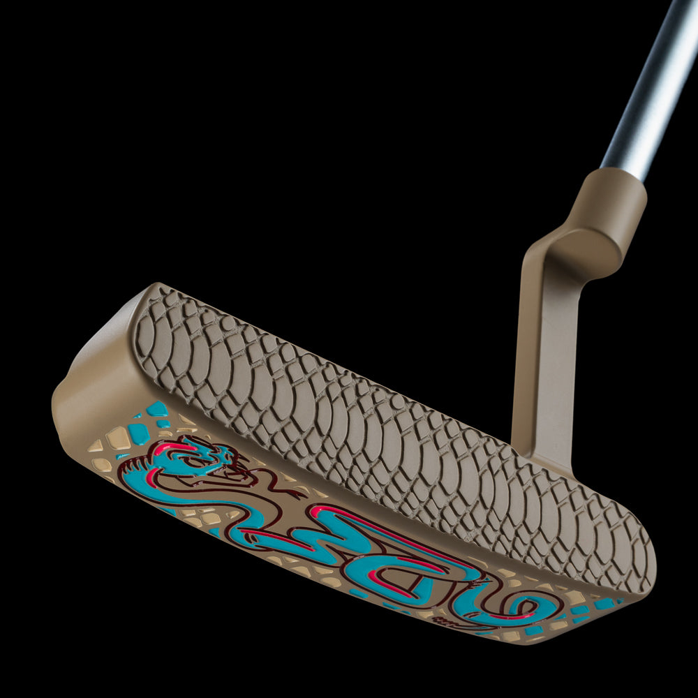 SWAG Golf Handsome One limited edition beige cerakote finish golf putter with a teal snake design and matching headcover.