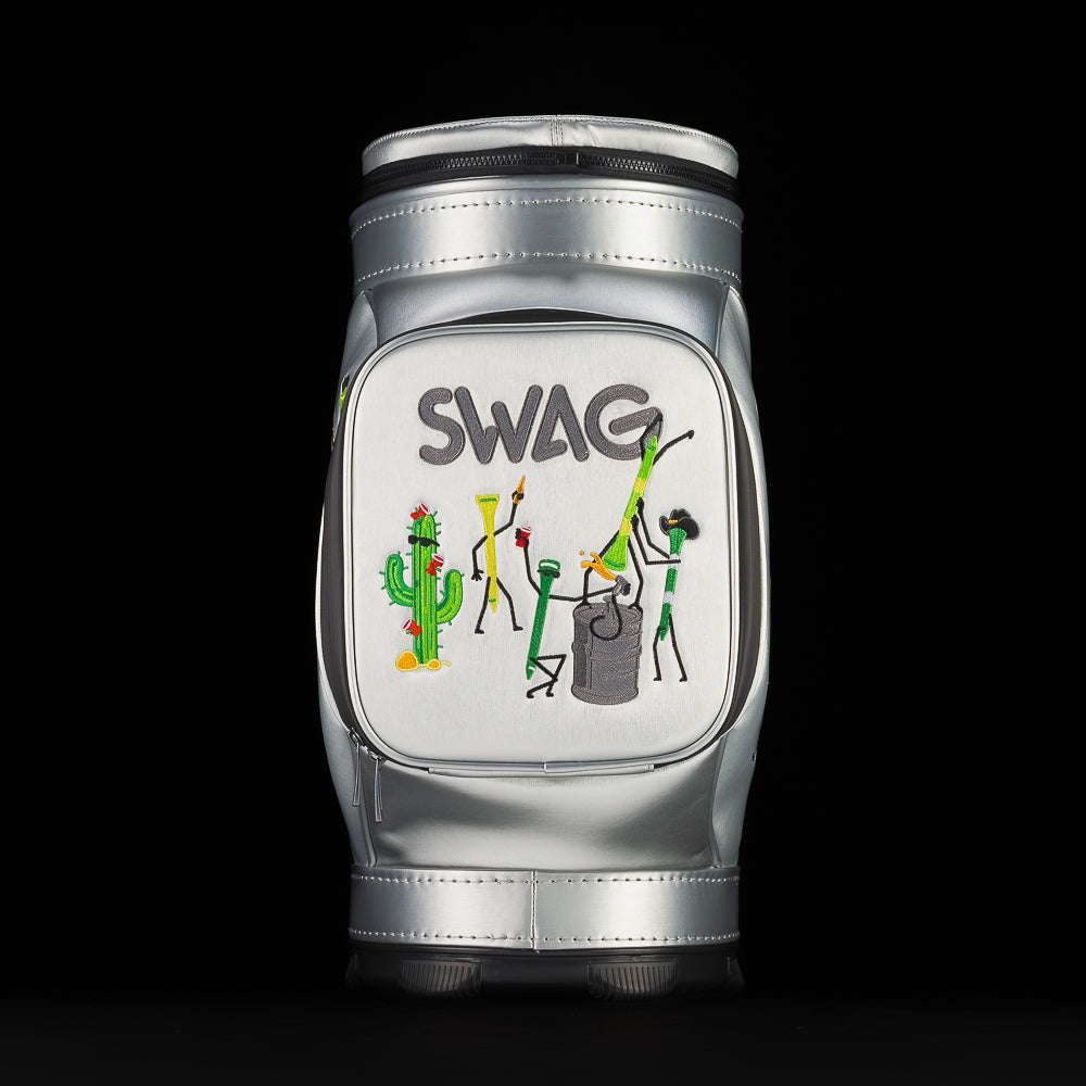 Front view of silver SWAG Golf Desert Tee Party Den Caddy showing front zip pocket with embroidered cactus, golf tees, and SWAG logo artwork.