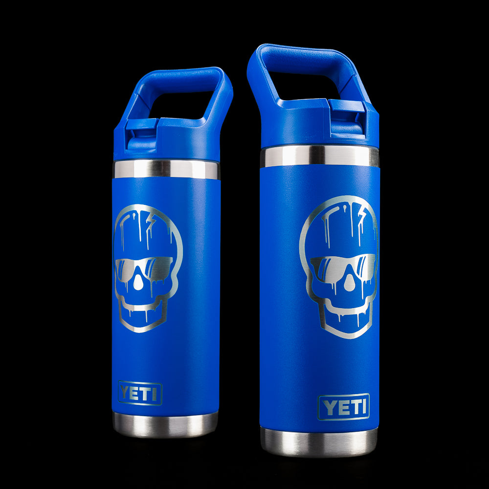 SWAG Golf x YETI Rambler 18 oz bottle in blue featuring the Dripping Skull graphic on both sides with a straw lid and YETI branding.