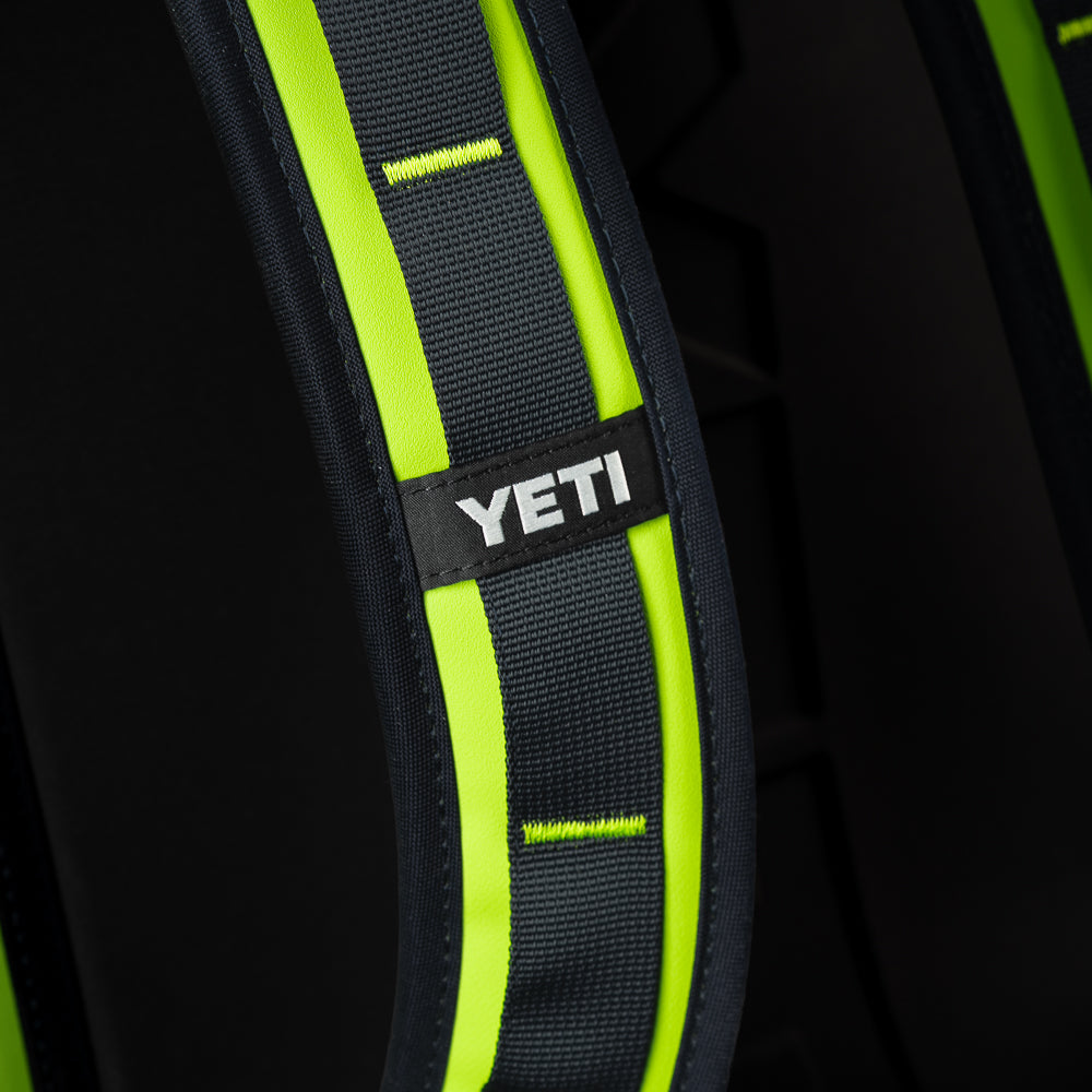 Close-up of the SWAG Golf x YETI Hopper M20 backpack soft cooler shoulder strap showing padded construction and YETI branding.