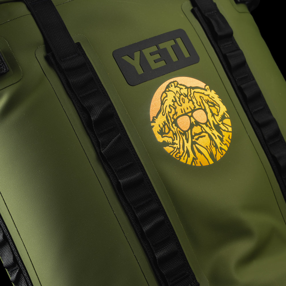 Close-up of the SWAG Golf x YETI Hopper M20 backpack soft cooler featuring the exclusive Swag Thing graphic on the front panel.