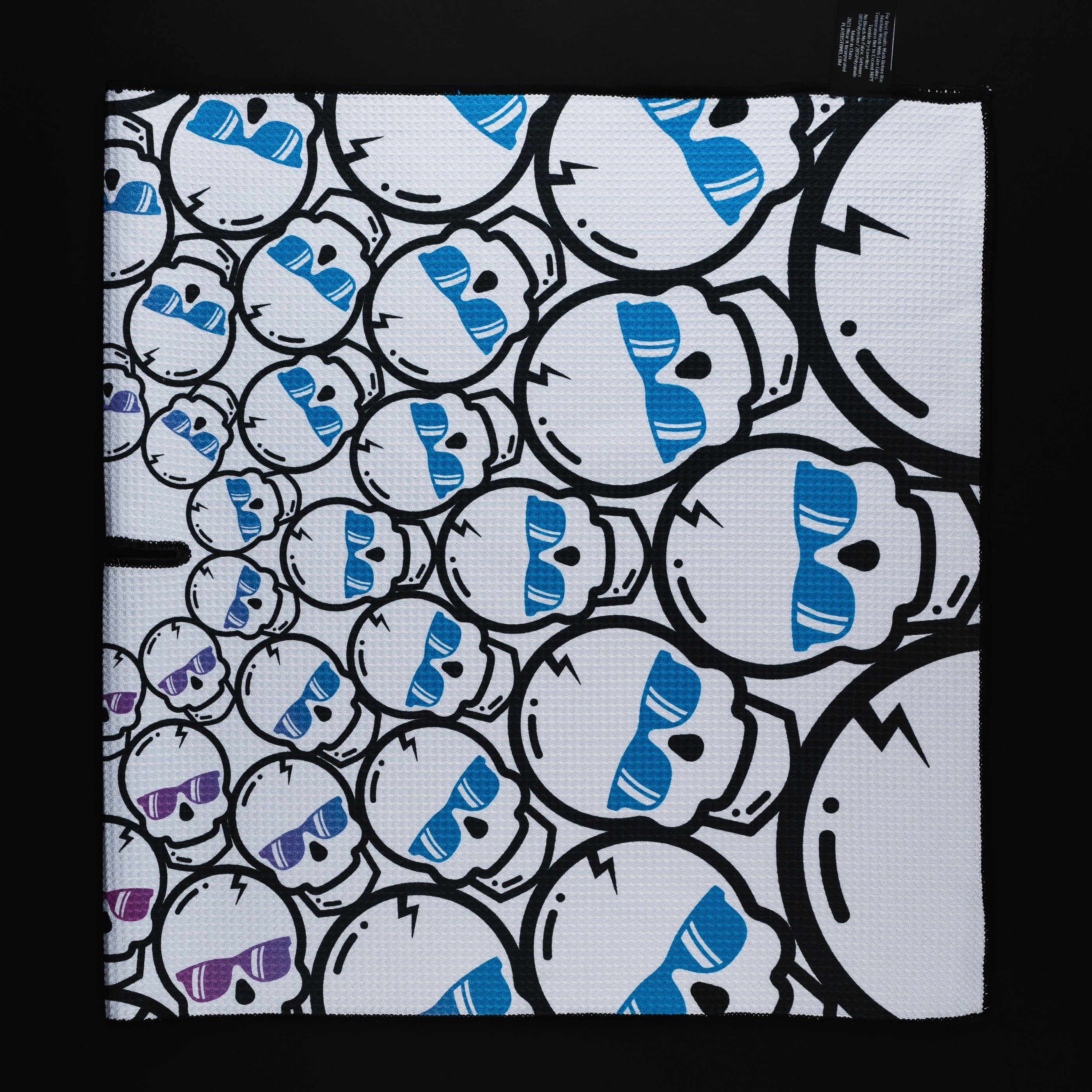 Swag concentric skulls white, blue and pink players golf towel accessory.