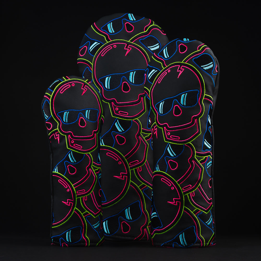 Eclipse Stacked Skulls 2.0 black, pink, green and blue wood head cover set of 3 which includes a driver, fairway and hybrid. All designed and made in the USA.