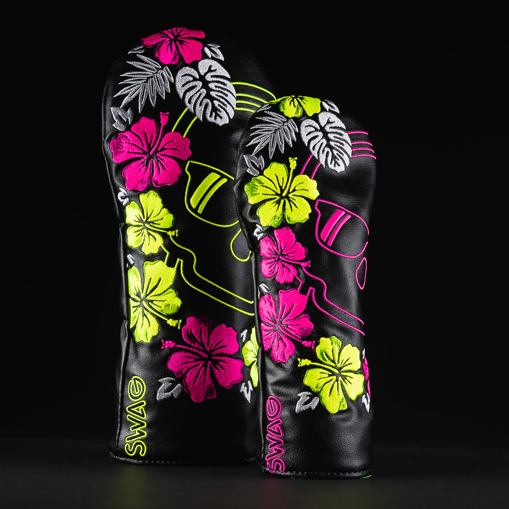 Floral skull black driver and fairway head cover set with pink and yellow hibiscus flowers.