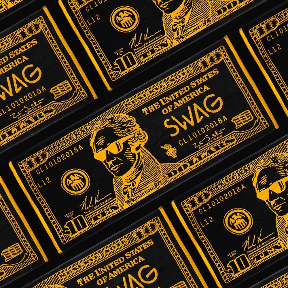 Broadway Hamilton $10 themed black and gold colored golf towel.