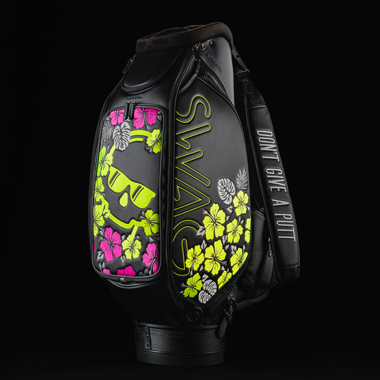 Swag black tour staff golf club bag with yellow and pink hibiscus flowers.