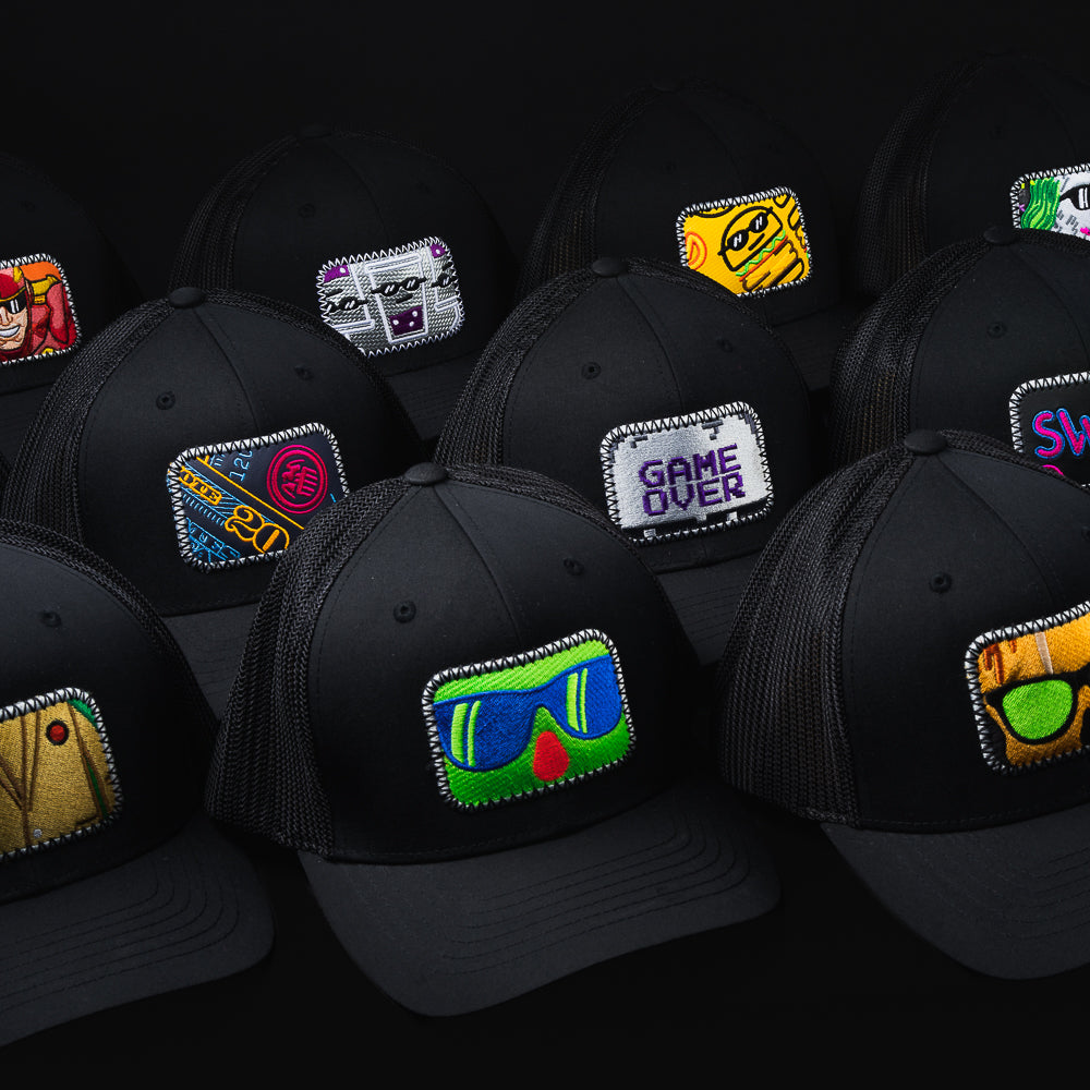 Black snapback hat featuring a patch made from recycled headcovers.