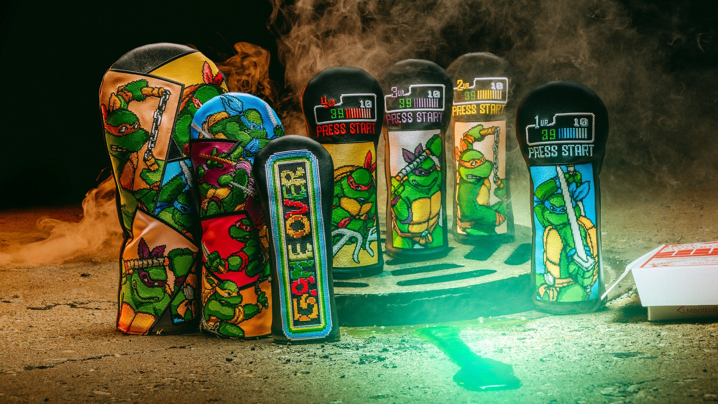 SWAG Golf x TMNT official golf accessories featuring driver, fairway, hybrid, and blade golf headcovers.