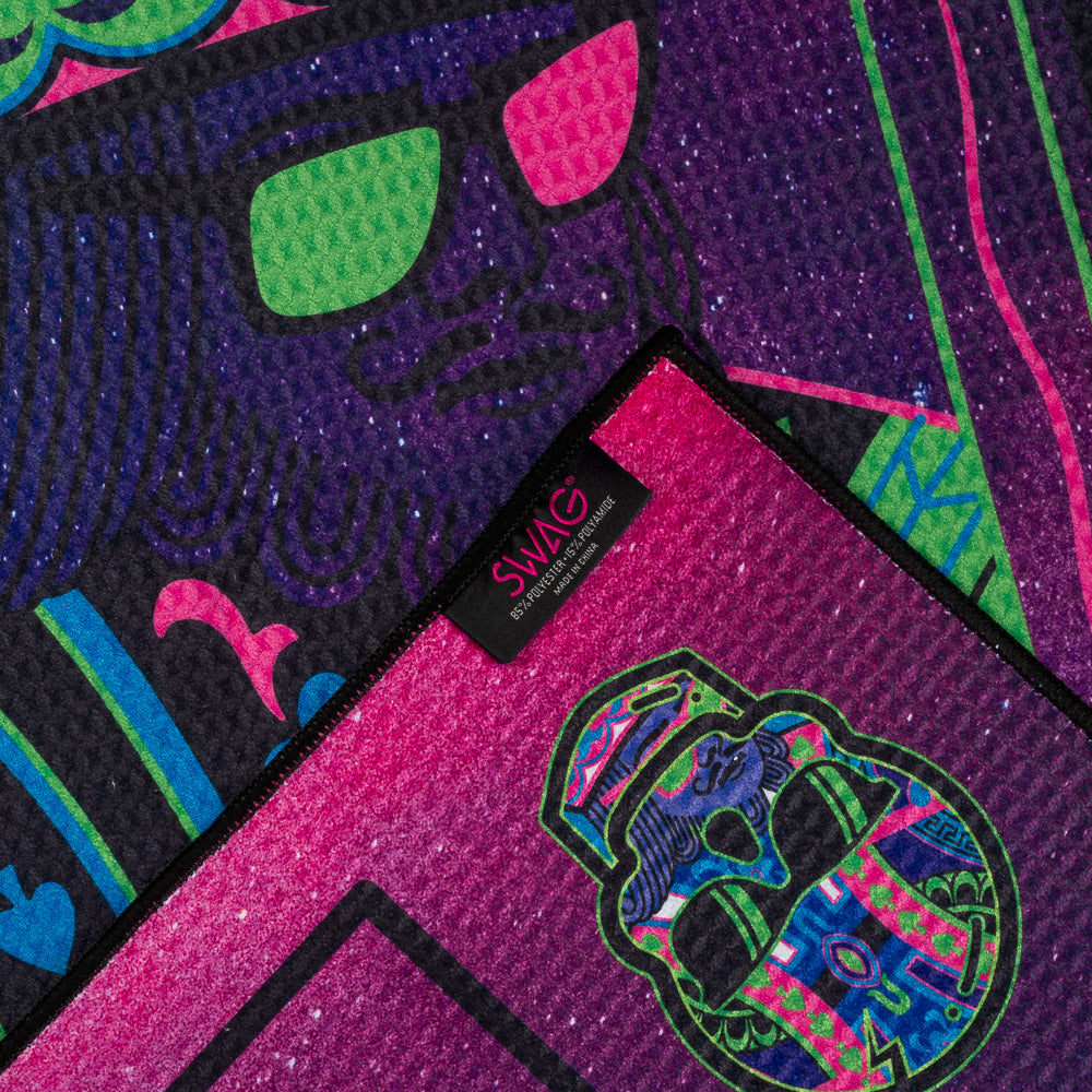Colorful playing card designs with neon pink, green, and blue on a black background