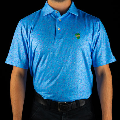 SWAG Golf X Peter Millar polo in flying bird print with neon SWAG skull logo on chest and embroidered SWAG on sleeve.