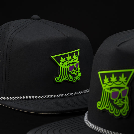 Melin Coronado Royal Highness snapback hat in black with green and purple.