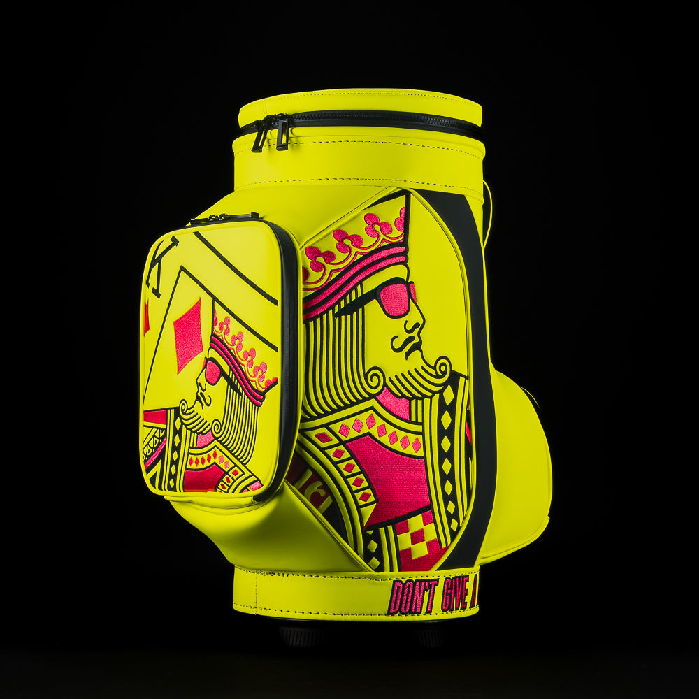 Neon yellow SWAG Golf den caddy zippered cooler with neon pink and black King playing card embroidered design.