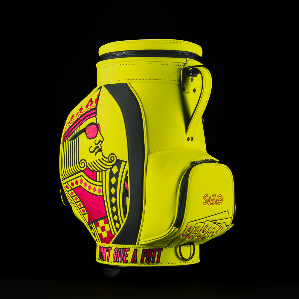 Neon yellow SWAG Golf den caddy zippered cooler with neon pink and black King playing card embroidered design.