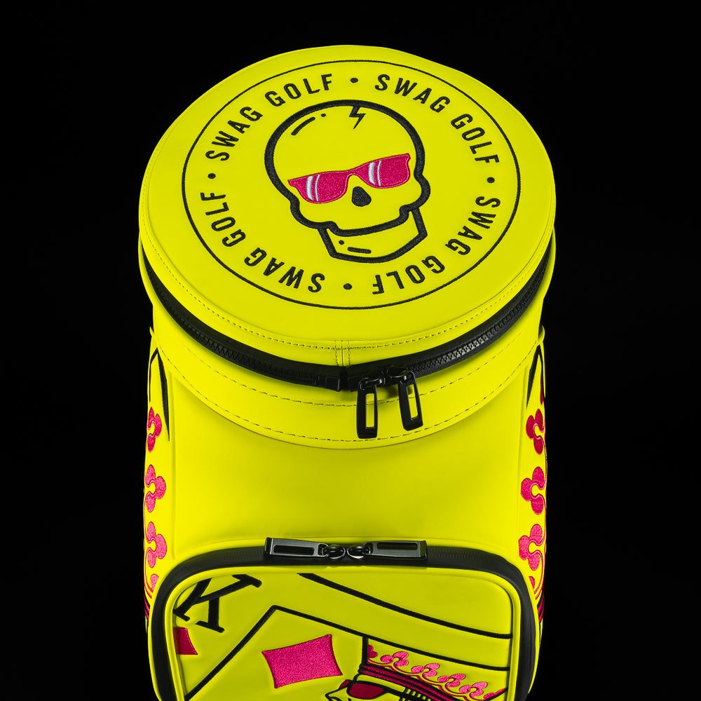 Neon yellow SWAG Golf den caddy zippered cooler with neon pink and black King playing card embroidered design.