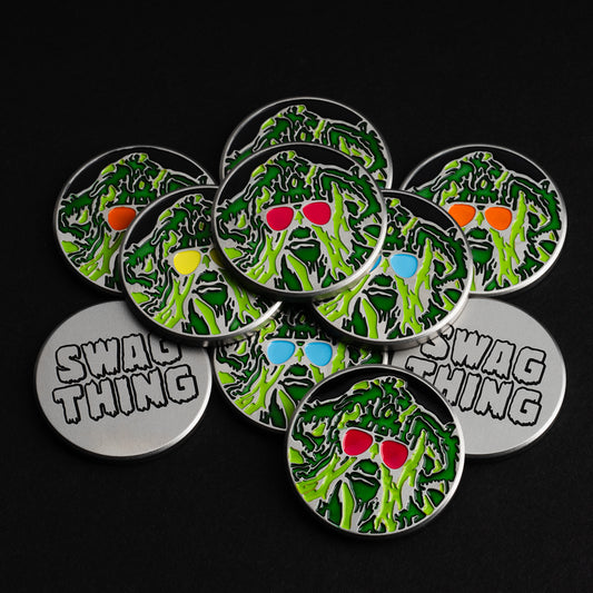 Swag Thing stainless steel hand-painted green and multi color golf ball marker accessory.