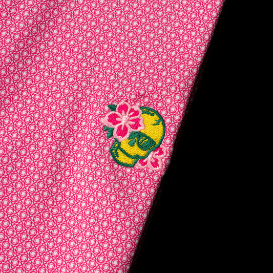 Swag x Peter Millar Azalea Skull Polo Shirt in pink with green and yellow.