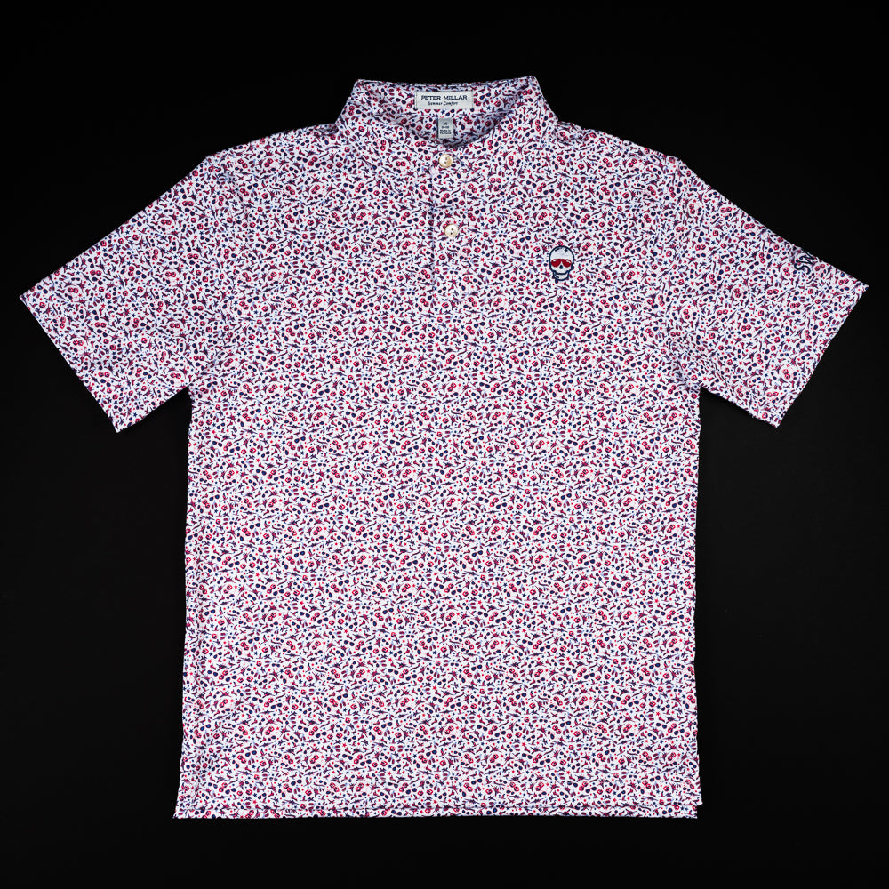 Swag x Peter Millar youth white, pink and red aviation print short sleeve polo shirt with an embroidered skull on the left chest.