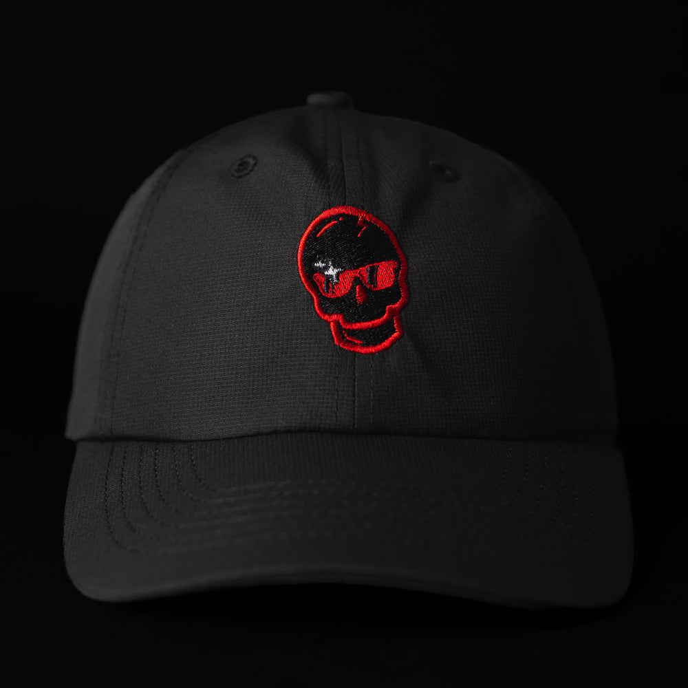 SWAG x Imperial black performance golf hat with red sparkle skull logo.