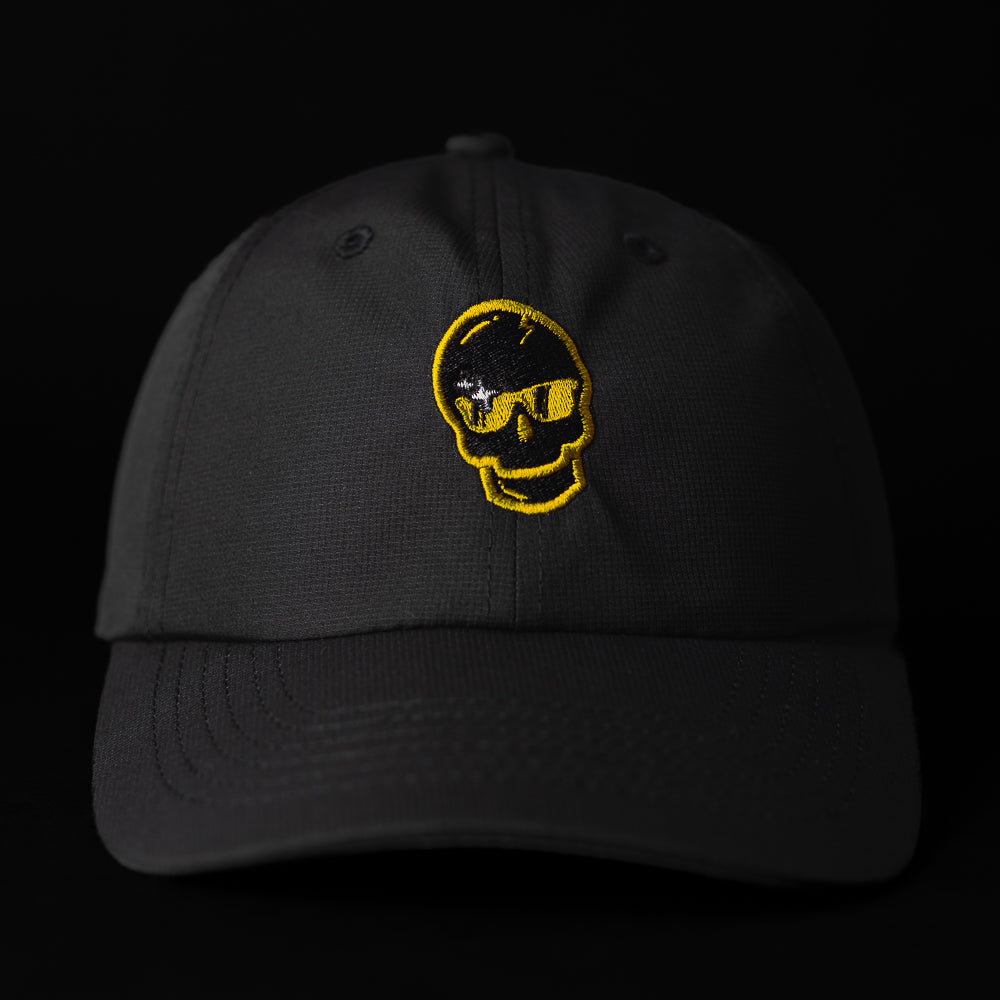 SWAG x Imperial black performance golf hat with yellow sparkle skull logo.