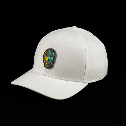 Side-angle view of the white SWAG Golf Skull hat featuring a multicolor skull patch with teal, orange, and black/grey detailing on the front panel.