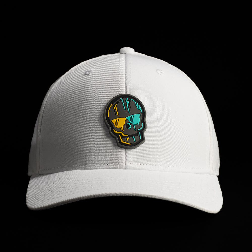Front view of a white SWAG Golf hat featuring a graphic skull patch with teal, oranges, and black/grey accents.