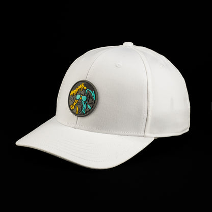 White SWAG Thing hat featuring a round multicolor SWAG Thing patch with teal, orange, and black artwork on the front and center.
