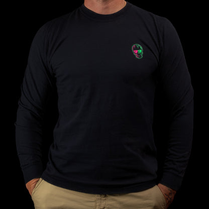 Front view of a black SWAG Golf long-sleeve shirt with a small neon green-and-pink skull logo on the left chest.