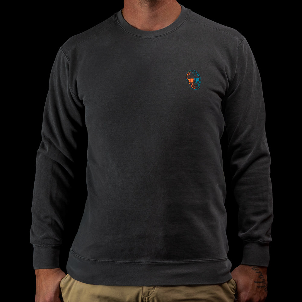 Front view of a black SWAG Golf sweatshirt with a small orange-and-teal skull logo on the left chest.