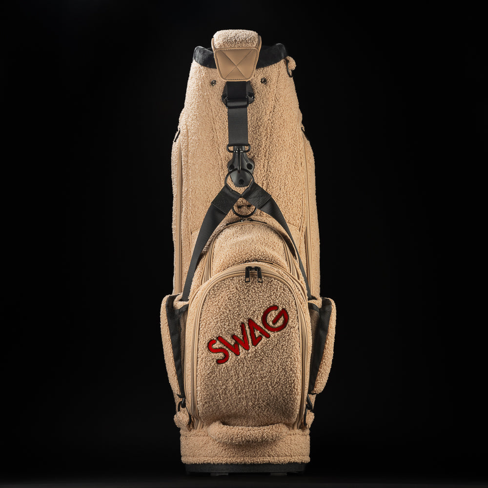 Mutts Putts Staff Bag made of teddy bear sherpa with a dog face stitched on the front and Mutts Putt tag on the side.