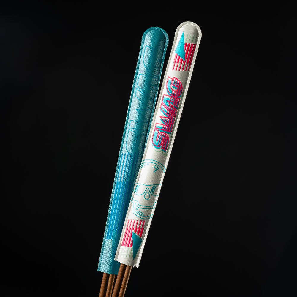 Retro Ski Alignment stick in neon pink, baby blue and white.