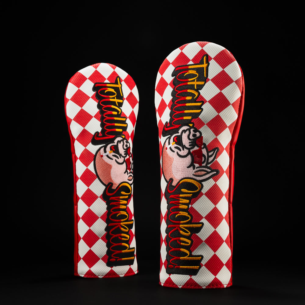 Totally Smoked red and white checker fairway golf headcover with pig character wearing red sunglasses.