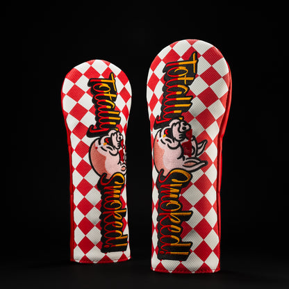 Totally Smoked red and white checker fairway golf headcover with pig character wearing red sunglasses.