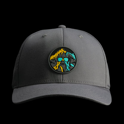 Front view of the grey SWAG Thing golf hat showcasing the circular SWAG Thing logo patch with bold teal, yellow, and black artwork.