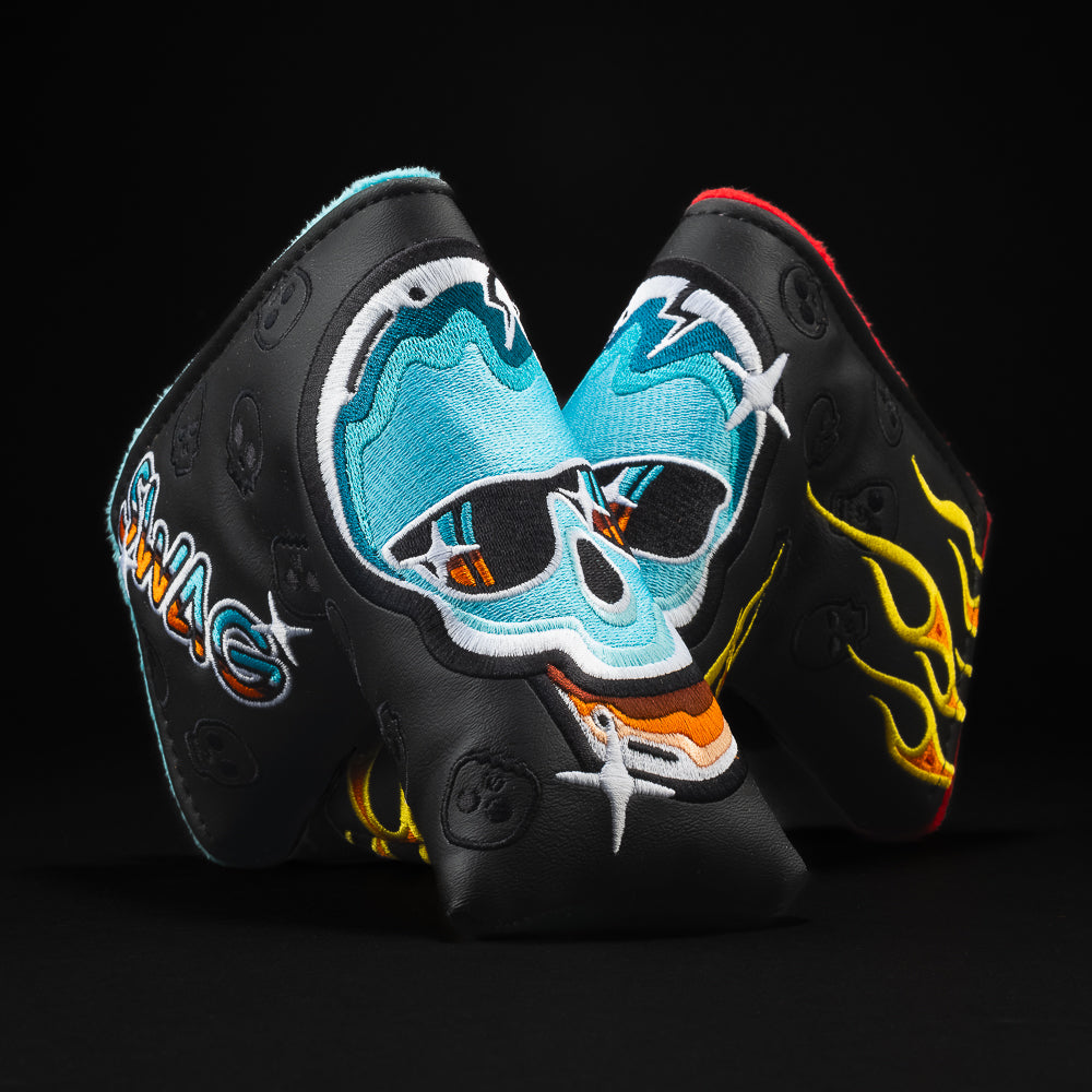 Chrome Skull in black with yellow flames and blue skull blade golf club headcover. 