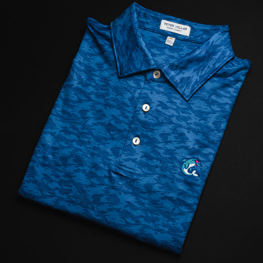 Swag x Peter Millar blue fish camo men's short sleeve golf polo shirt with an embroidered dolphin on the left chest.