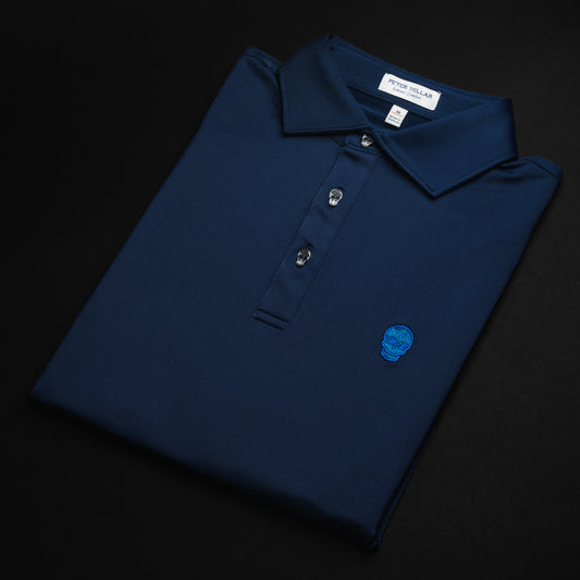 Swag x Peter Millar navy blue men's short sleeve golf polo shirt with skull buttons.