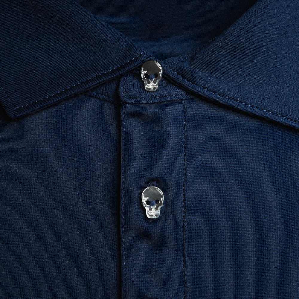 Swag x Peter Millar navy blue men's short sleeve golf polo shirt with skull buttons.