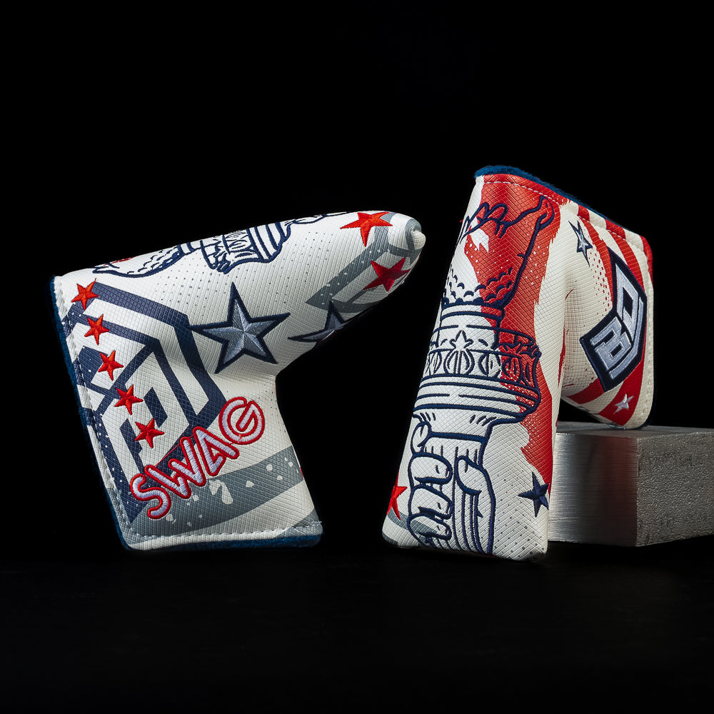 SWAG Golf x BD red, white, and blue blade golf headcover with lady liberty's torch and BD shield logo on the side.
