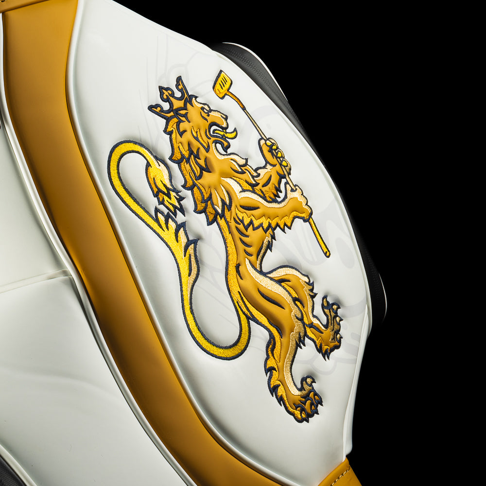 Detail of gold embroidered lion holding a putter on the side panel of the Bomba Den Caddy cooler.