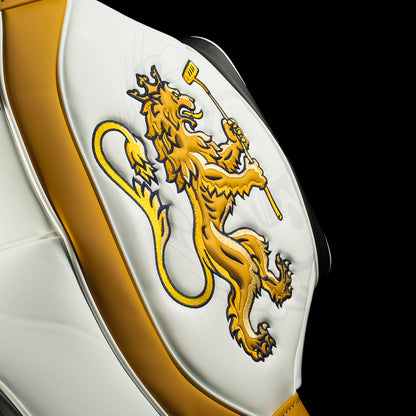 Detail of gold embroidered lion holding a putter on the side panel of the Bomba Den Caddy cooler.