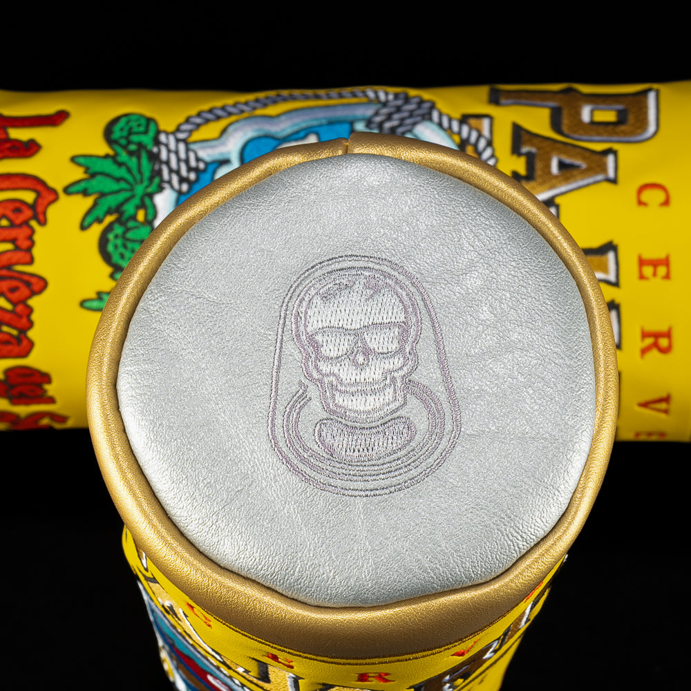 Top view of the Paharito Barrel Fairway cover showing metallic silver lid with subtle embroidered skull logo and gold rim.