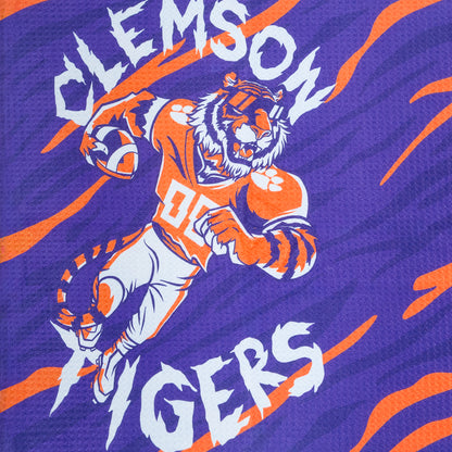 Clemson Tigers golf towel with tiger and paw print design on a purple background