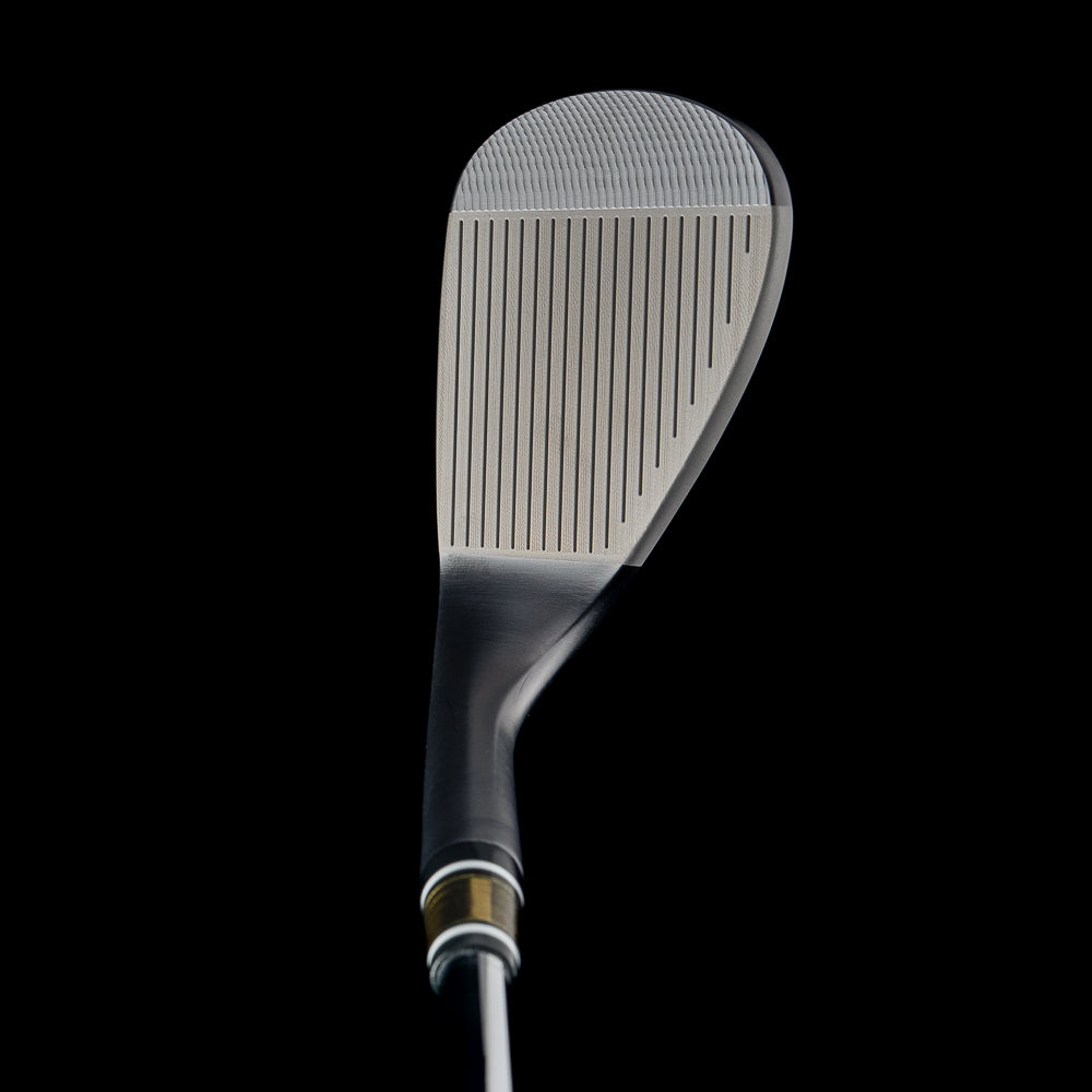 Golf club wedge on a black background