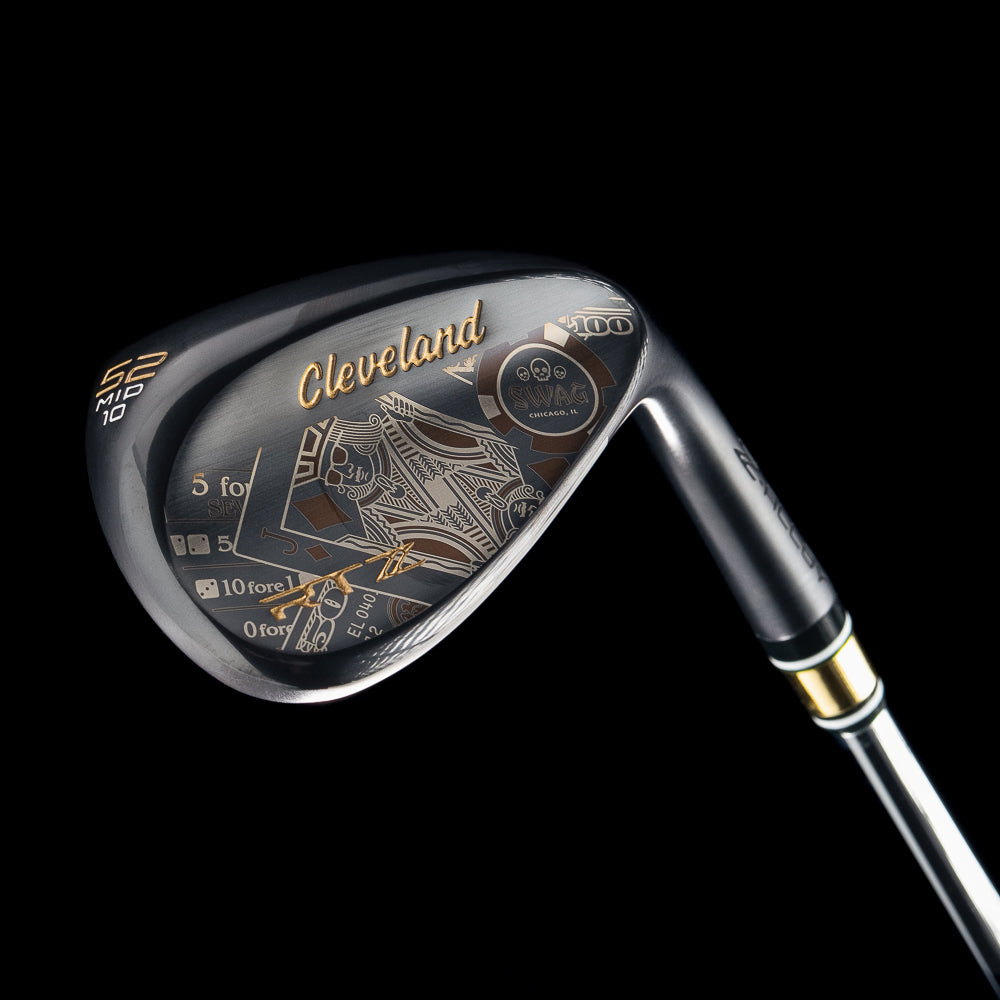 Black satin 52 degree golf wedge with Cleveland x SWAG Golf branding on a black background