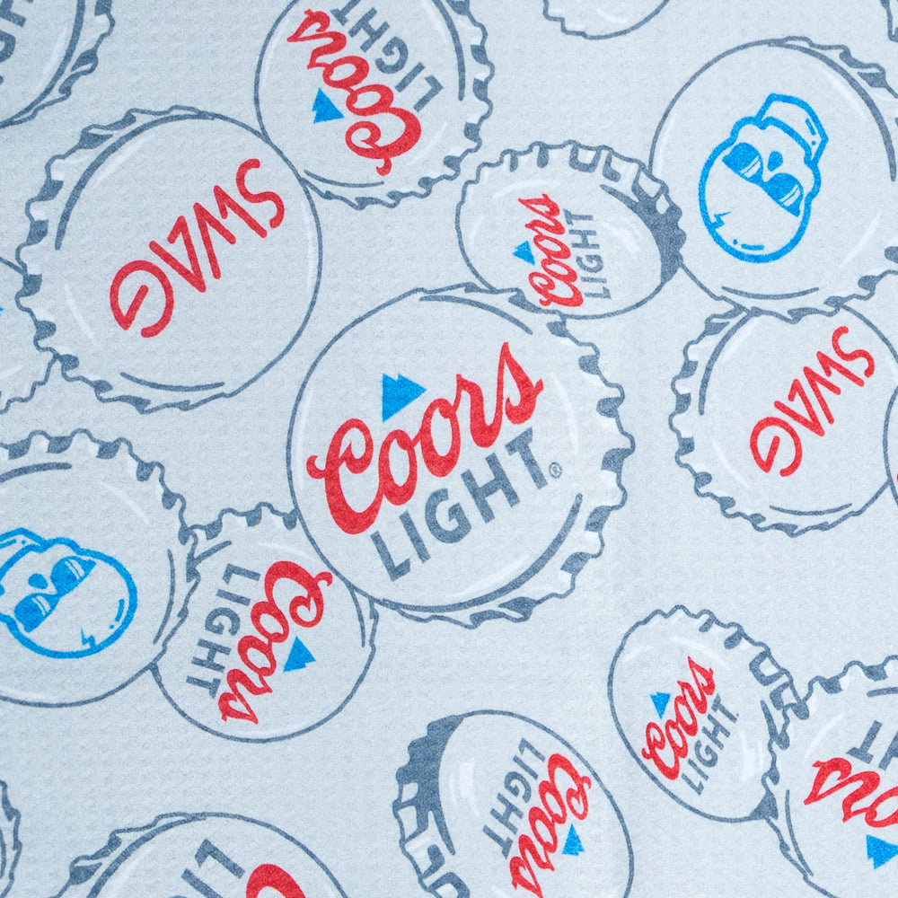 SWAG x Coors Light branded golf towel with stacked bottle caps design on a white background.