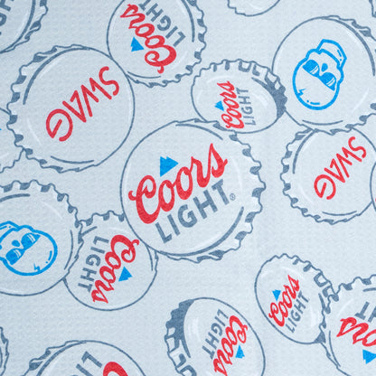 SWAG x Coors Light branded golf towel with stacked bottle caps design on a white background.