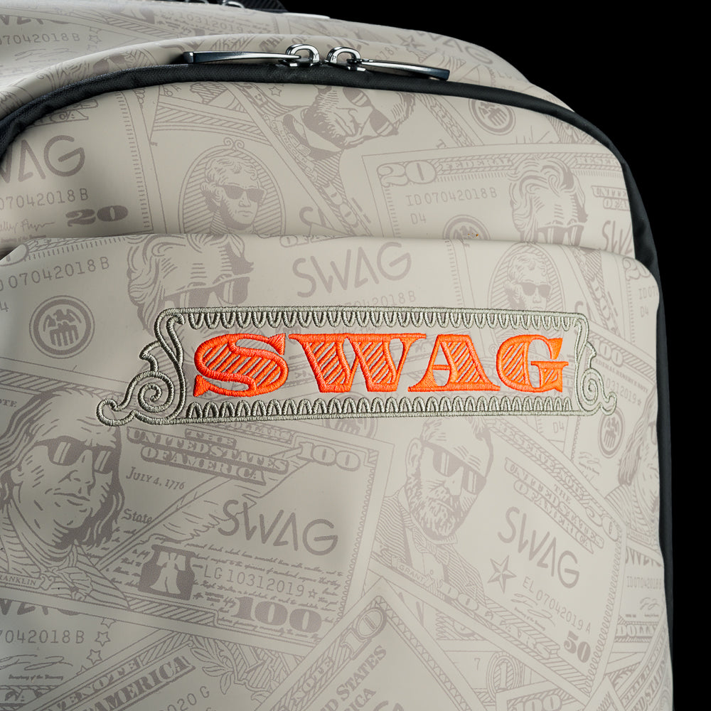 Cream currency themed backpack with 'SWAG' text and George washington embroidered details.