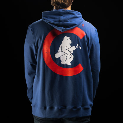 A person shown from the back wearing a navy blue hoodie with a large red and white graphic on the back, photographed against a black background.