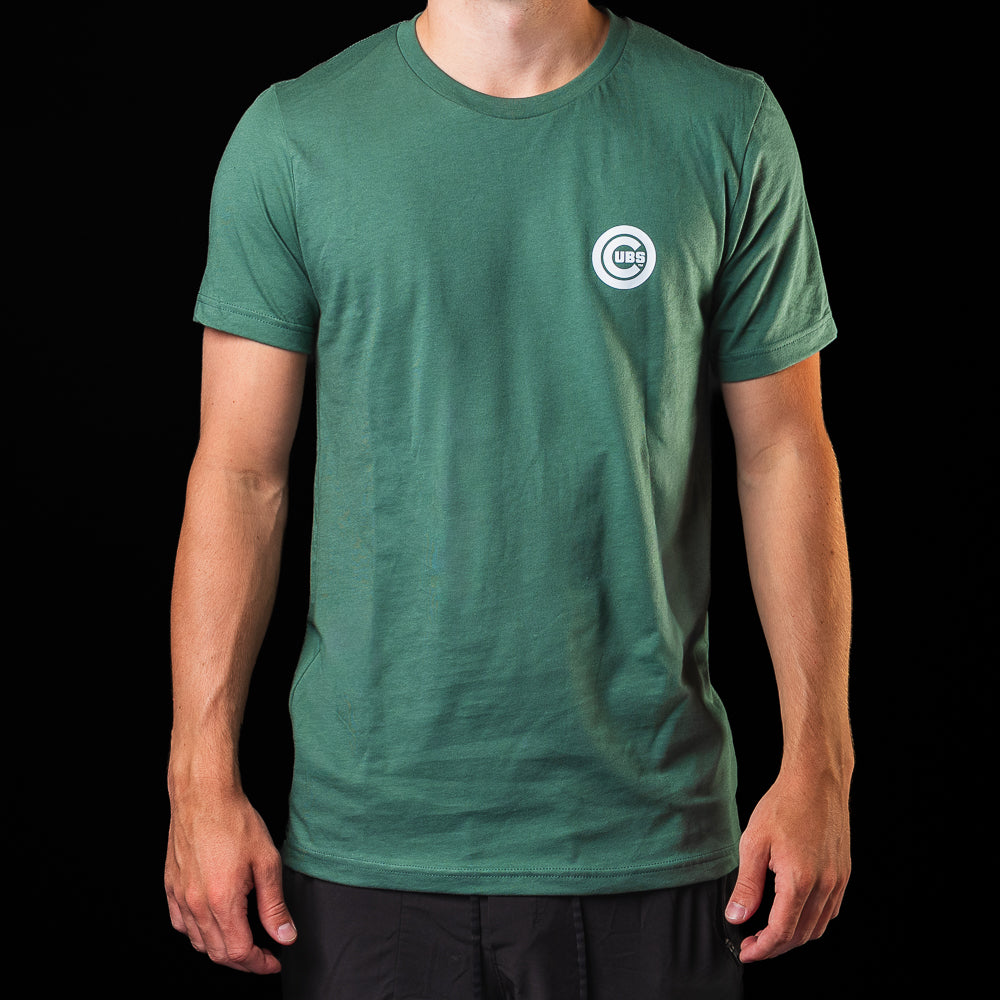 Front view of the Chicago Cubs Be Alert For Foul Balls T-Shirt in green with a small Cubs chest logo.